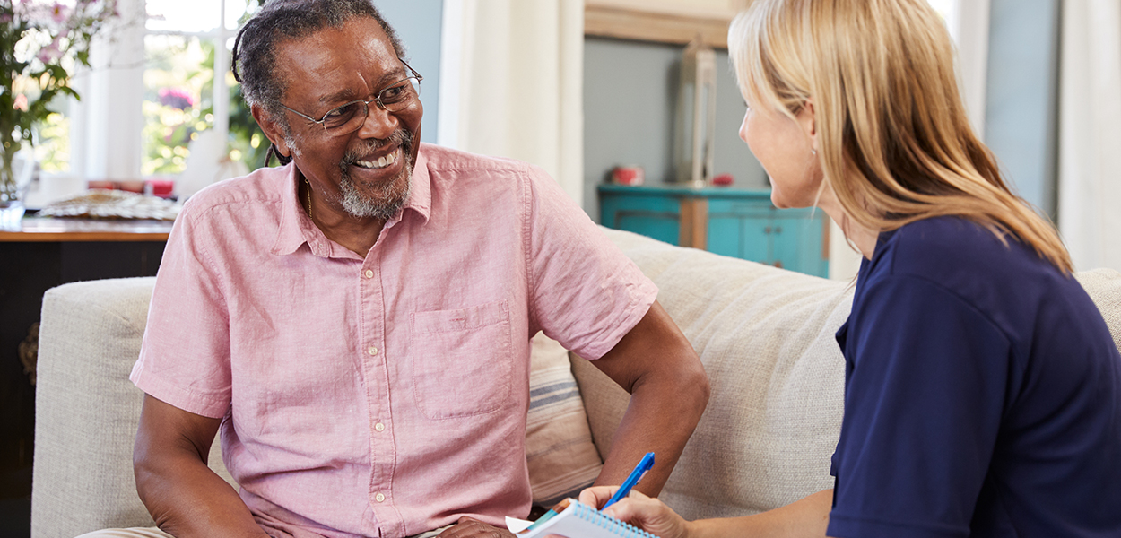 Image of nurse talking to an elderly person.